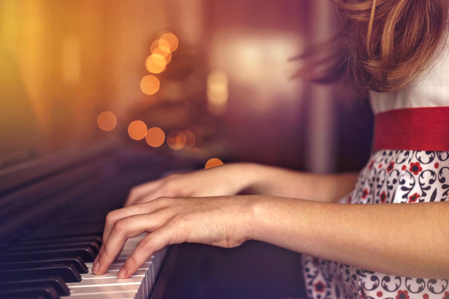 Photo of a person playing the piano with great hands technique