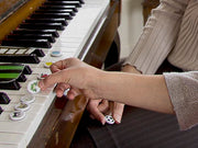 Character magnets used on the piano to learn note positions